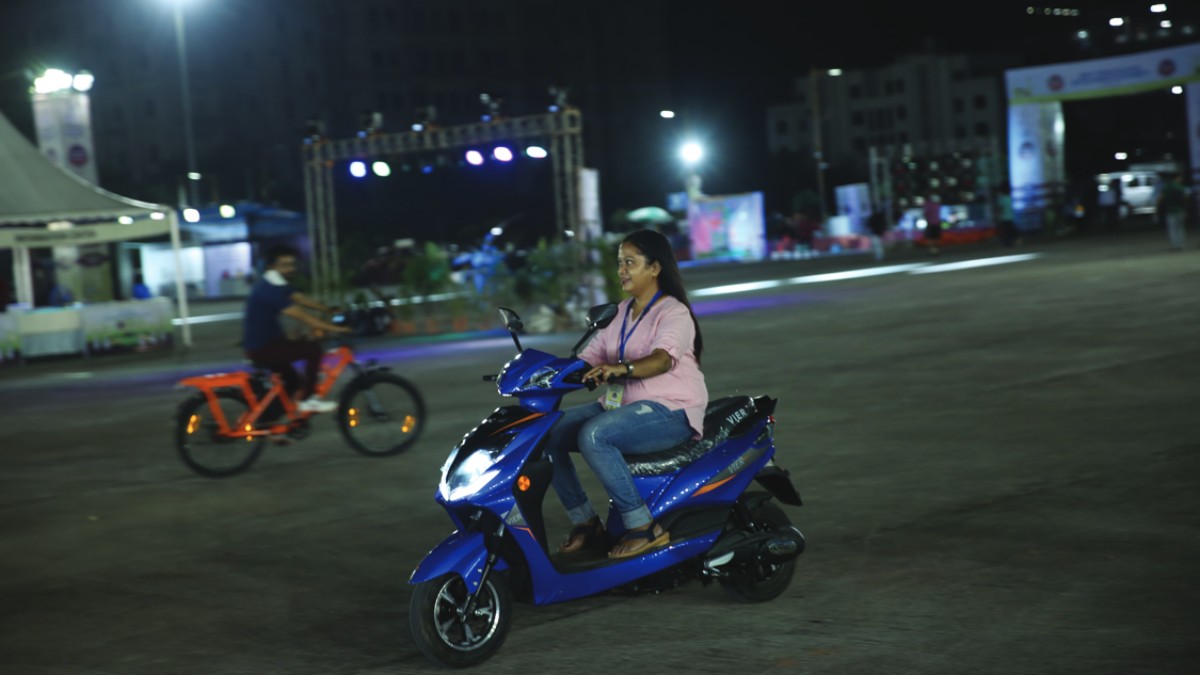 Visitor doing test ride of Electric Scooter at the EV Carnival