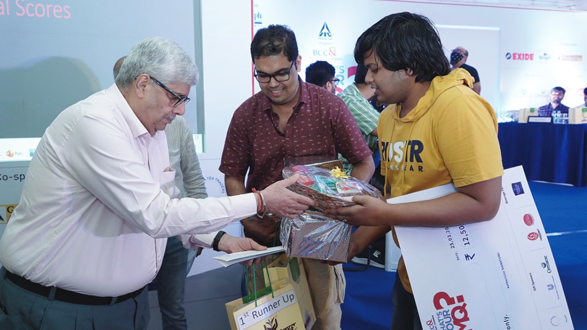 Prize and Gift Hampers being given to Mr. Samanway Banerjee and Mr. Piyus Kedia − the 1st Runner up Team (M&Ms) by Mr. Anoop Hoon Chairperson, Marketing & Brand Committee of The Bengal Chamber